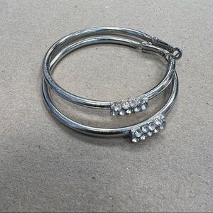 𝅺silver large hoop earrings with rhinestone embellishments on front,